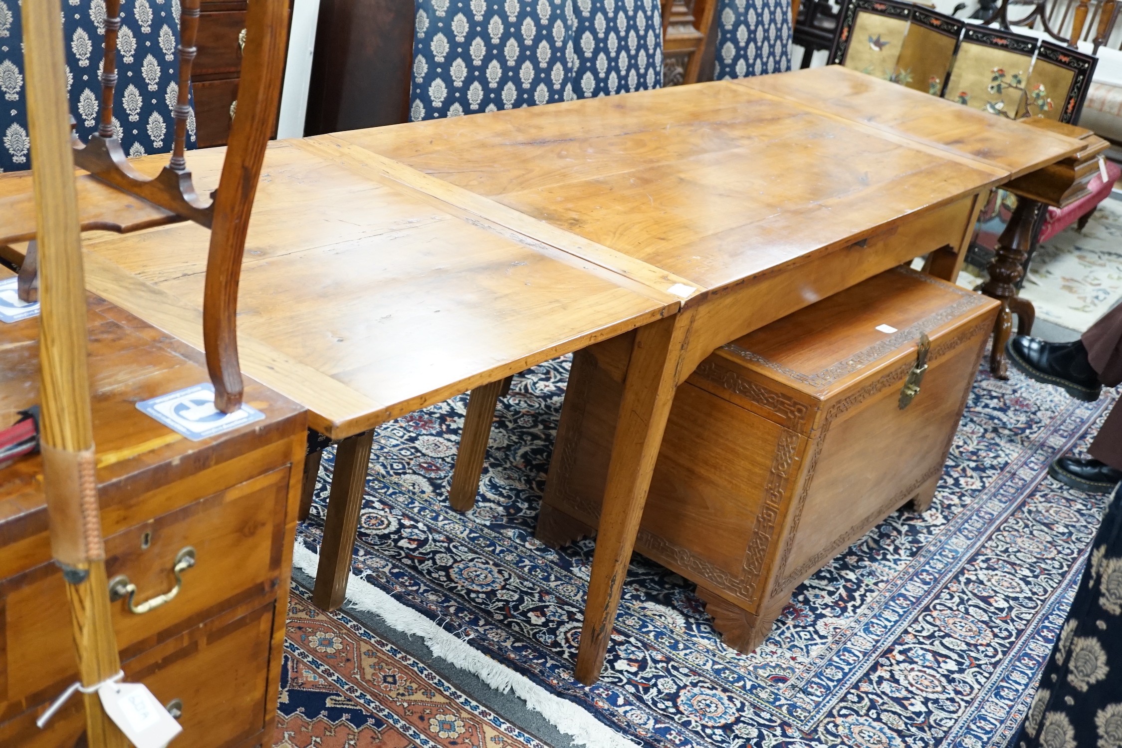 A late 19th century French fruitwood draw leaf table, 166 x 81cm, extends to 317cm, height 78cm *Please note the sale commences at 9am.